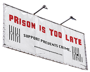 Hanging public campaign sign with a prevention message